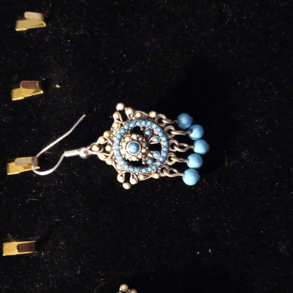 Beautiful turquoise color beads all over these earrings. Give off Navajo vibe.